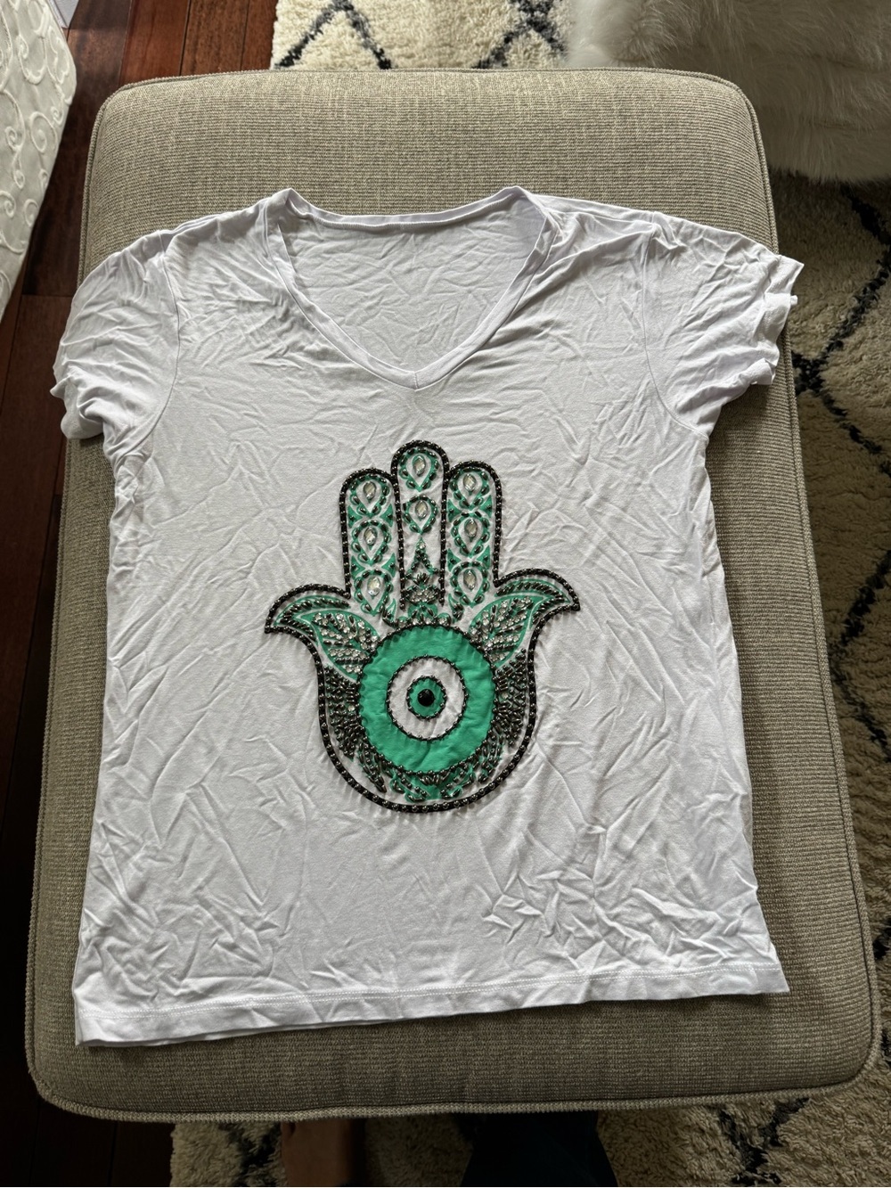 White V-Neck Tee with Green Hamsa Hand Motif